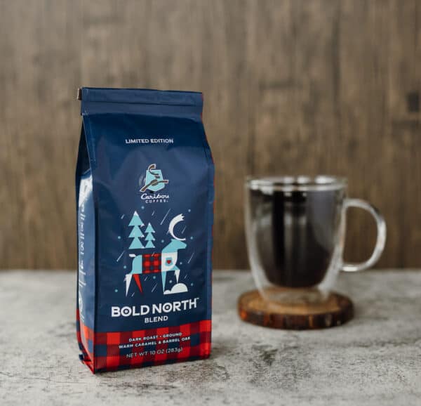 A bag of bold north blend and a cup of coffee.