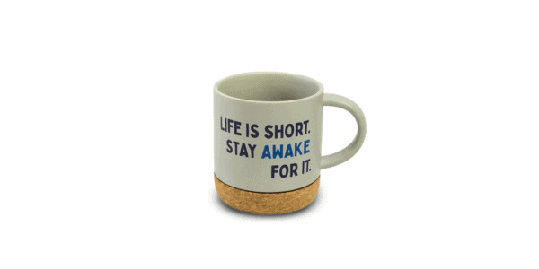 Beige coffee mug with cork bottom and "Life is short. Stay awake for it." text