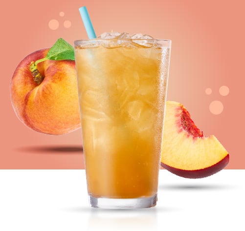 Sparkling Peach Black Tea. Caribou BOUsted caffeinated beverages. Peaches behind the drink