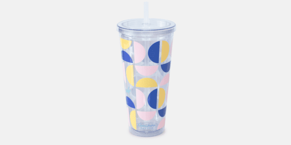 Clear Tumbler with a straw. Tumbler has colorful shapes on it.