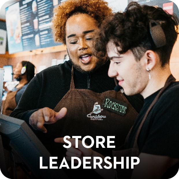 Store Leadership. Two Employees talking