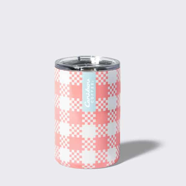Pink plaid short tumbler with a blue stripe and a caribou coffee logo. Add one to your cart now