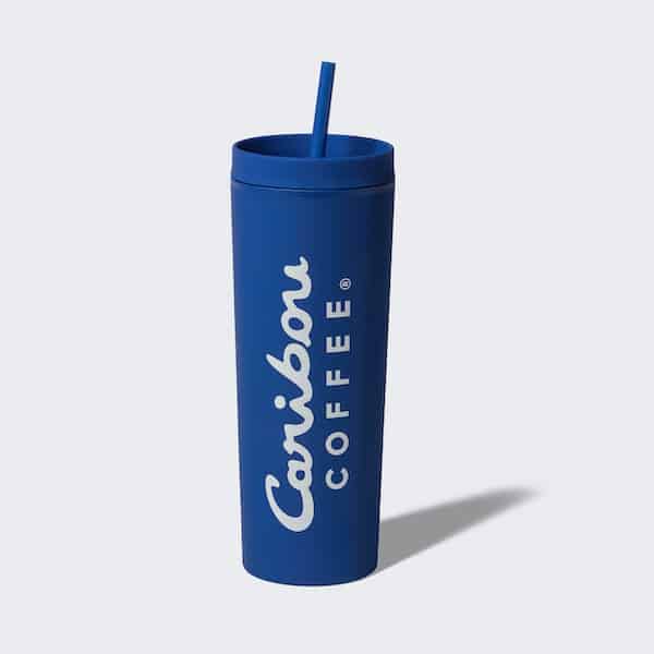 Blue silicone tumbler with a straw and a caribou coffee logo. Buy one now.