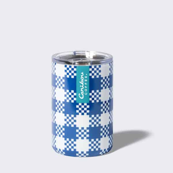 Blue plaid tumbler with a blue stripe and a caribou coffee logo. Add to cart now.