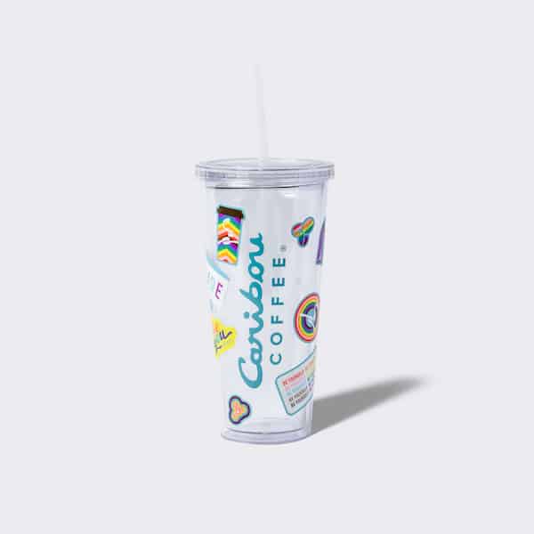 Clear tumbler with stickers applied to it. Buy one now
