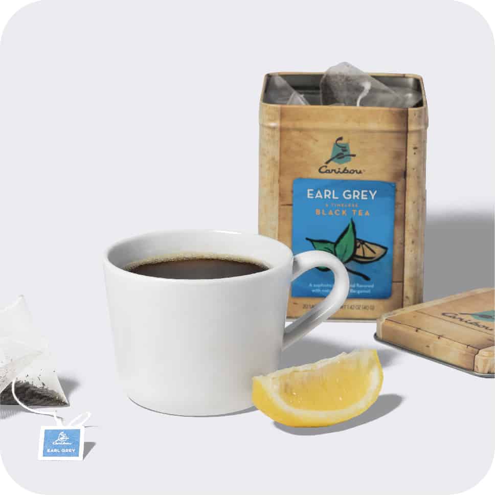 A box of earl grey tea and a cup of tea. Buy tea now
