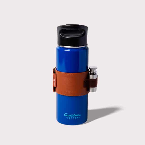 Blue tumbler with a cheers flask