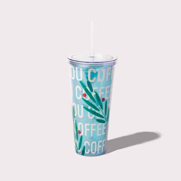 Blue clear tumbler with a straw.