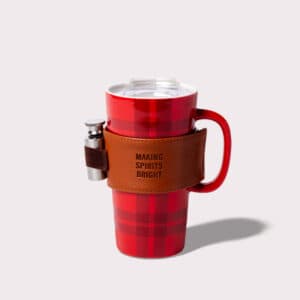 Red and black tumbler mug with a flask. Flask has a leather clutch that says making spirits bright.