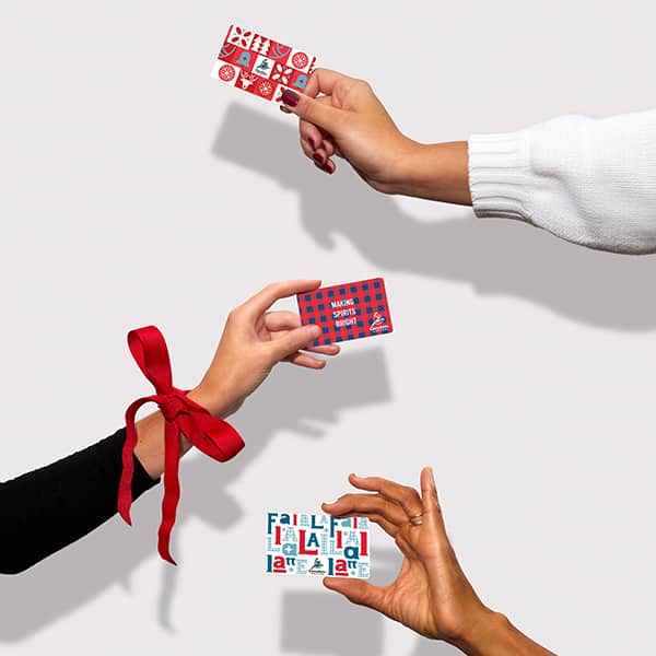 People holding gift cards