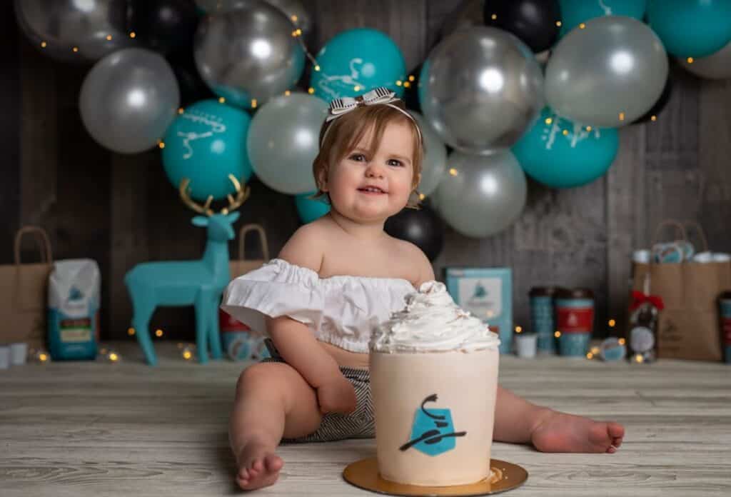 baby eloise celebrates her birthday with a caribou themed cake and decor