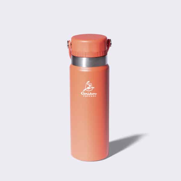 Stainless steel coral water bottle with a Caribou Coffee logo and a handle.
