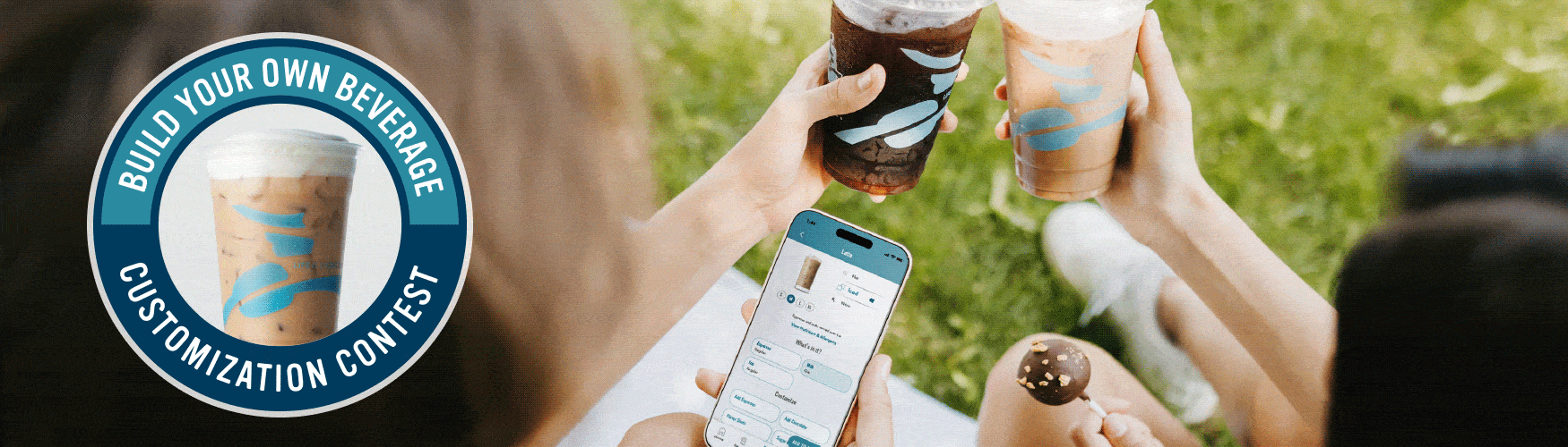 Build your own beverage customization contest. Two women cheersing cups and looking at the caribou coffee app. 