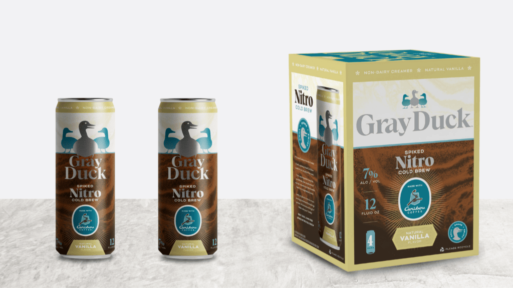 Box of Gray Duck nitro coffee with two cans to the left of it side by side