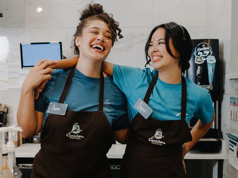 Two Caribou Employees enjoy their day in the coffeehouse